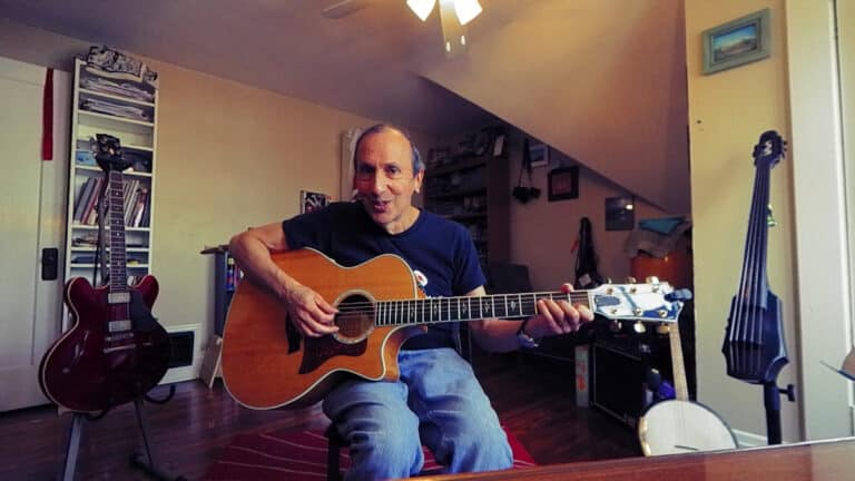 Screenshot of Bobby Fisher from a video teaching about building 7th chords on guitar.