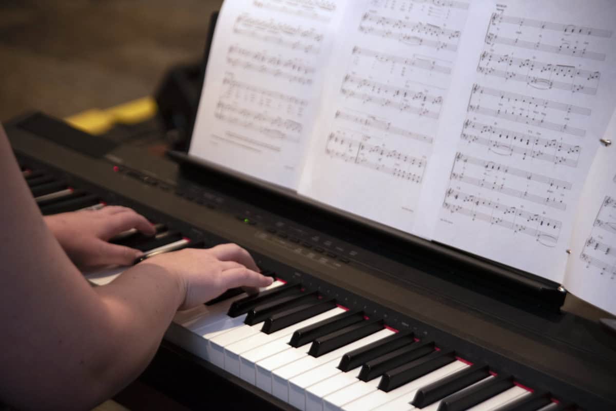 A photo of someone playing a keyboard during liturgy