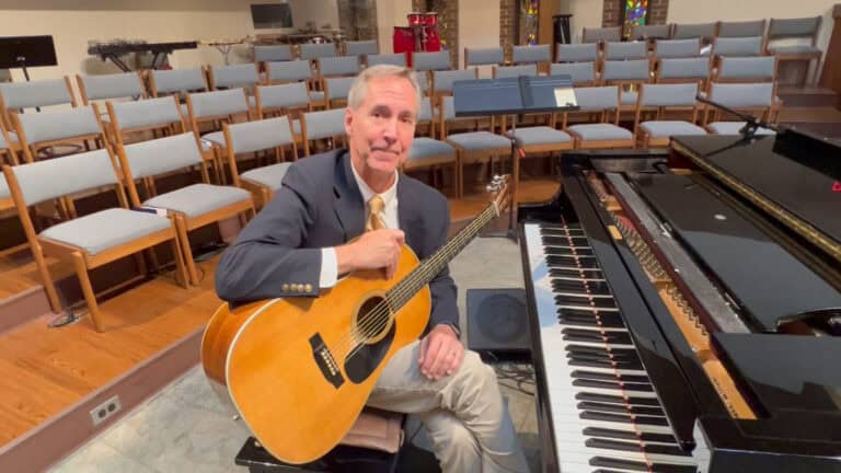 Photo of Steve Petrunak teaching about tuning a guitar to a piano