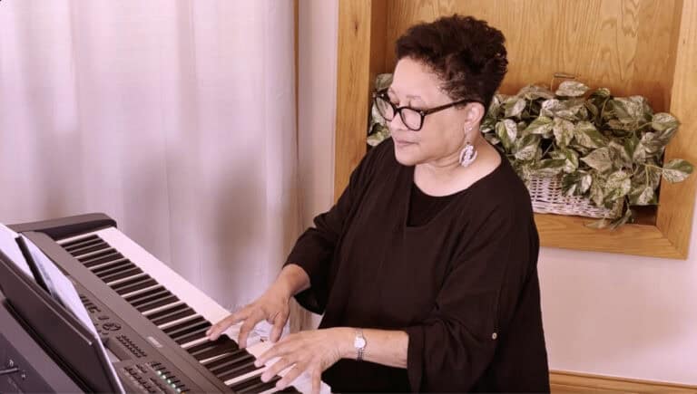Screenshot of Lynne Gray sharing tips on conducting from the piano