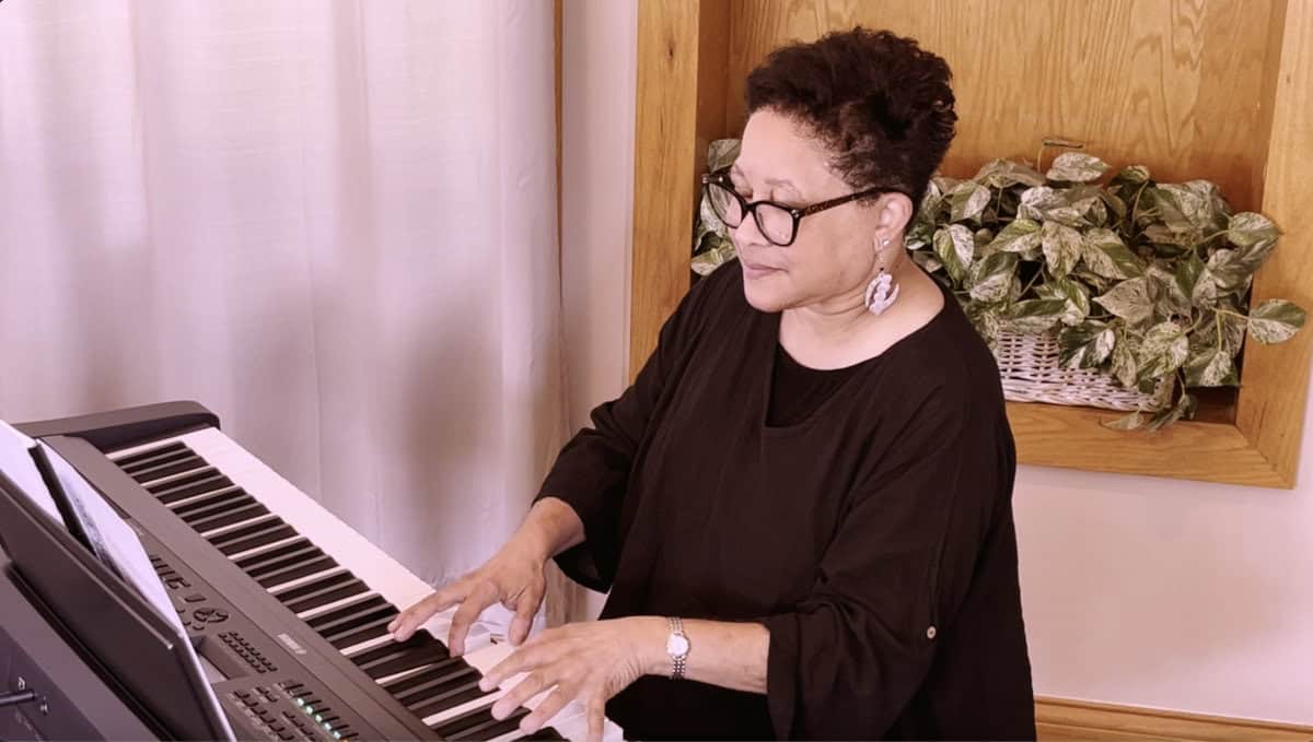 Screenshot of Lynne Gray sharing tips on conducting from the piano