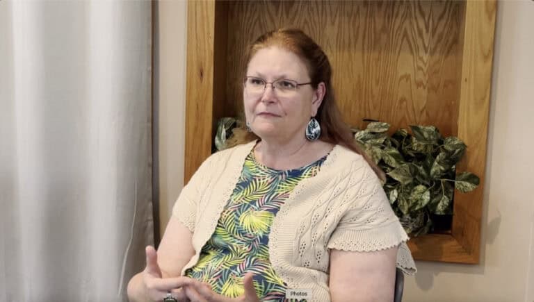 Photo of Dr. Mary Dumm being interviewed about her journey in ministry