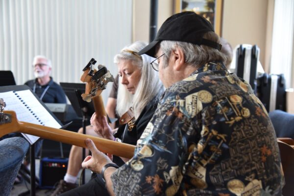Instrumental ensemble rehearsing together at a liturgical music conference