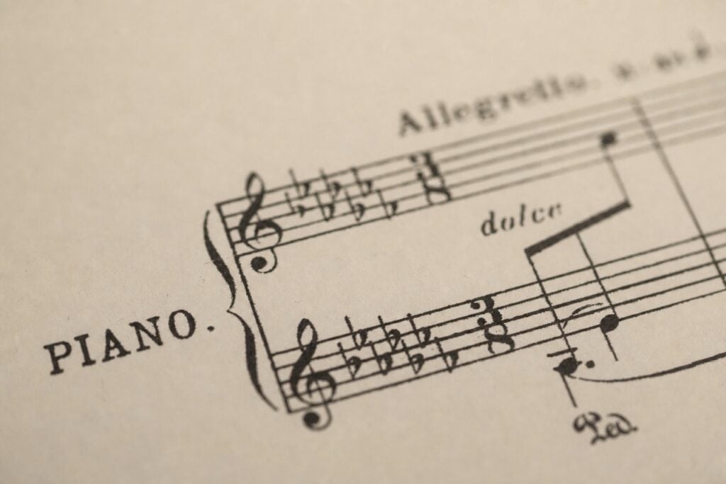 Photo of a piece of music showing time signatures