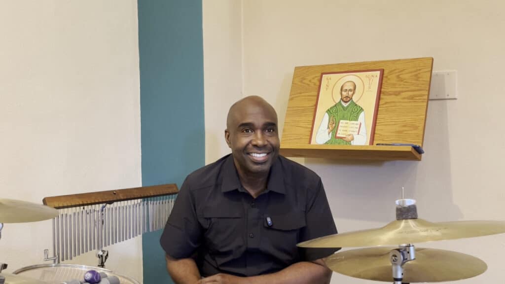 Screenshot of Dion Clay sharing tips for percussion in liturgical music